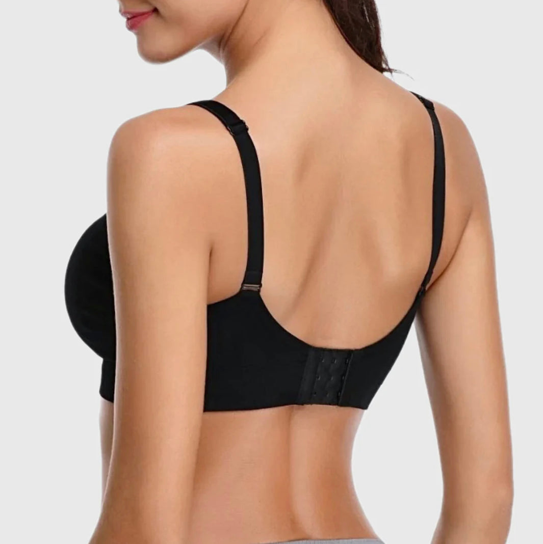 Black bra worn by a model on a plain background